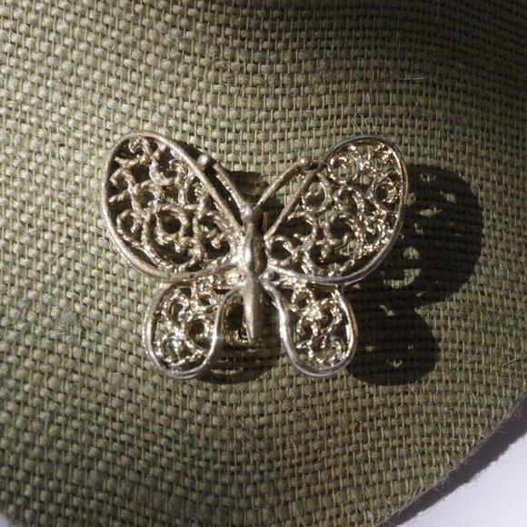 gerry`s Jewelry - Women`s faded gold tone filigree butterfly marked